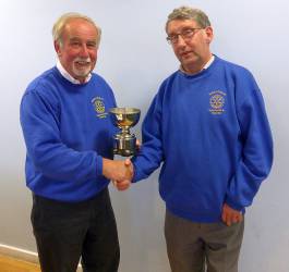 Brian Ulyatt receiving the Rotarian of the Year Award from past President Norman Whyte